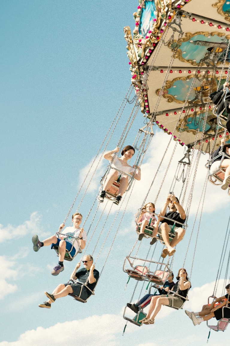 People enjoying a carousel ride